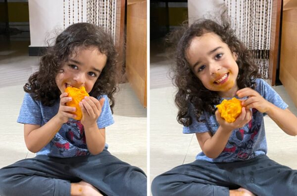 诺亚正在吃芒果